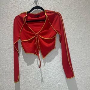 Stretchy orange shrug.